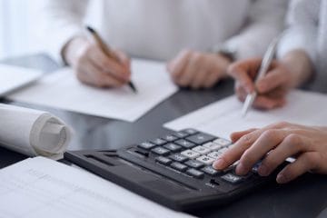 Accountants performing day-to-day accounting tasks in the office.